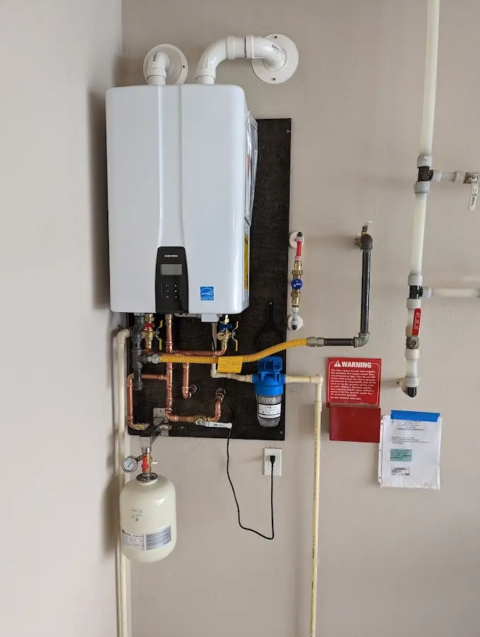 Professional plumber installing copper piping in a Monte Vista home